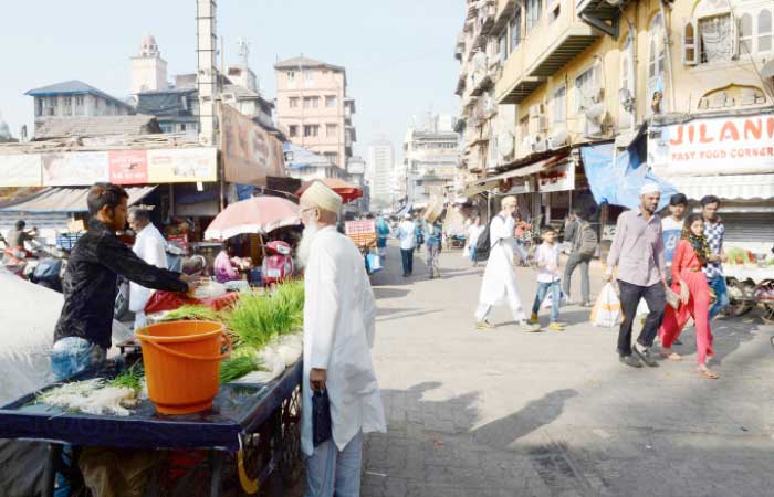 This photo shows members of the Dawoodi Bohra community in the Bhendi Bazaar area of Mumbai, which is being redeveloped under the Cluster Development Act 2009 by the Saifee Burhani Upliftment Trust. — AFP