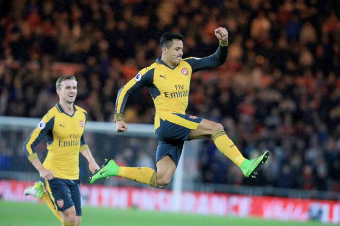 Arsenal’s Chilean striker Alexis Sanchez celebrates scoring his team’”s first goal during the English Premier League football match between Middlesbrough and Arsenal at Riverside Stadium in Middlesbrough on Monday. — AFP