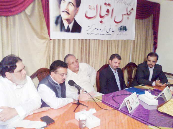 Pak Welfare Consul Arshad Munir delivering his speech while chairing the meeting of Majlis-e-Iqbal on Friday. — SG photo