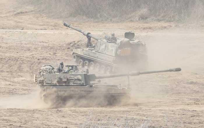 South Korean Army K-9 self-propelled howitzers move during the annual exercise in Paju, South Korea, near the border with North Korea, on Saturday. — AP