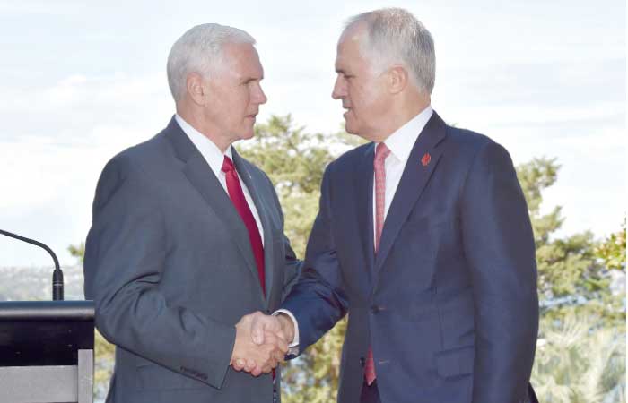 US Vice President Mike Pence, left, shakes hand with Australian Prime Minister Malcolm Turnbull as they arrive for a joint press conference at the Kirribilli House Sydney on Saturday. — AFP