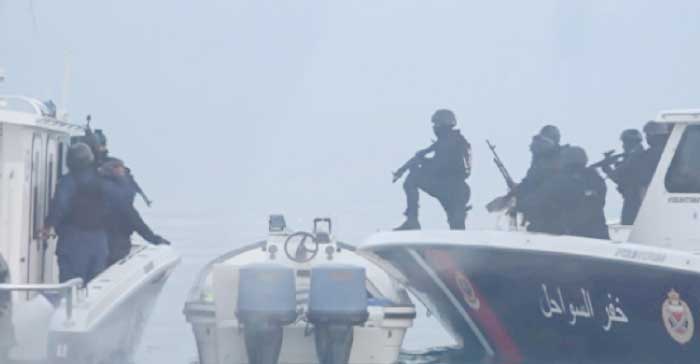 A still image taken from a video provided by Bahraini security officials shows Bahraini forces raiding a speedboat manned by Shiite militant fugitives it says were heading for Iran from Bahrain’s northeastern coast. Text on screen reads, “seizing the boat, and detaining the fugitives and evacuating their dead and wounded.” — Reuters