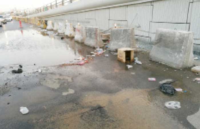 The flooded street along the under-construction King Abdulaziz Bridge on Makarona Street after the pipe breakdown. — Okaz photo