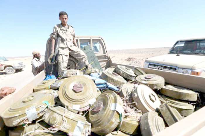 A Yemeni government soldier stands on a truck transporting land mines left by the Houthi rebels in Al-Jadaan area, in the country’s central province of Marib. — Reuters file photo