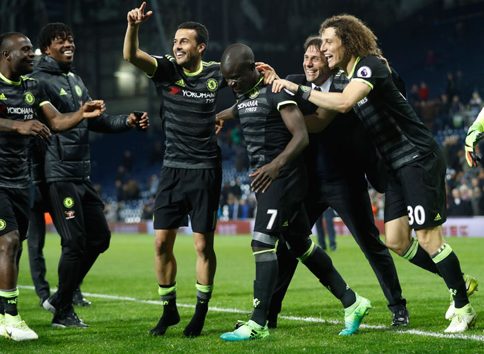 Chelsea manager Antonio Conte, Pedro, N'Golo Kante, and David Luiz celebrate winning the Premier League title. — AFP