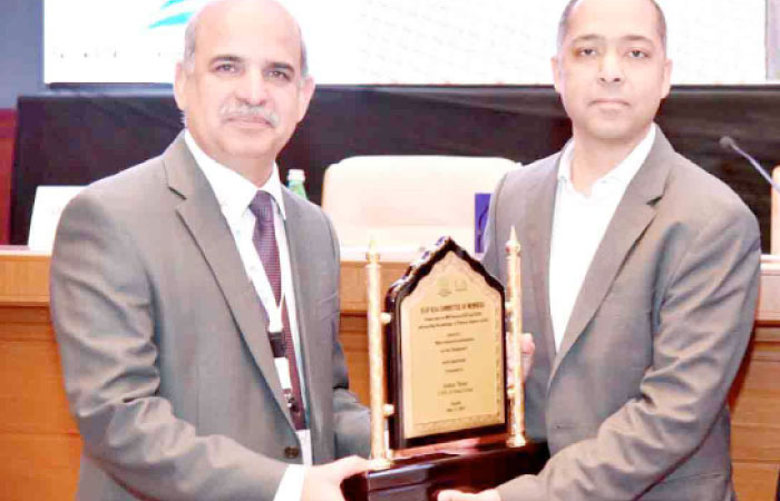 Asher Noor receiving his award from Pakistan Ambassador Khan Hasham bin Saddique. — Courtesy photo