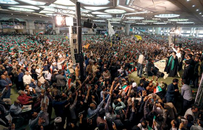 Iranian presidential candidate Ebrahim Raisi greets his supporters during a campaign rally at Imam Khomeini Mosque in the capital Tehran on May 16, 2017.  — AFP