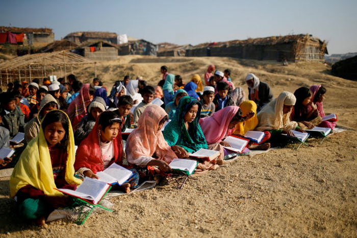 FILE PHOTO: Rohingya refugee children attend an open air Arabic school at Kutupalang Unregistered Refugee Camp, where they learn to read the Quran, in Cox's Bazar, Bangladesh, February 4, 2017. — Reuters