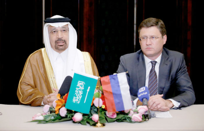 Saudi Arabia›s Energy Minister Khalid Al-Falih (L) and Russia’s Energy Minister Alexander Novak attend a joint briefing in Beijing on Monday. — Reuters