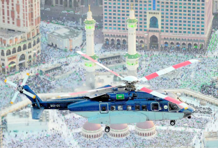 A Security Aviation helicopter hovers over the areas around the Grand Mosque in Makkah. — Okaz photo