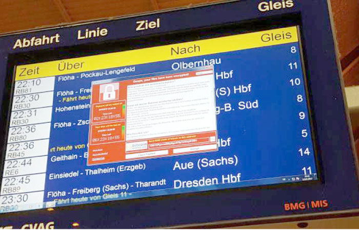 A window announcing the encryption of data including a requirement to pay appears on an electronic timetable display at the railway station in Chemnitz, eastern Germany, on Friday. — AFP