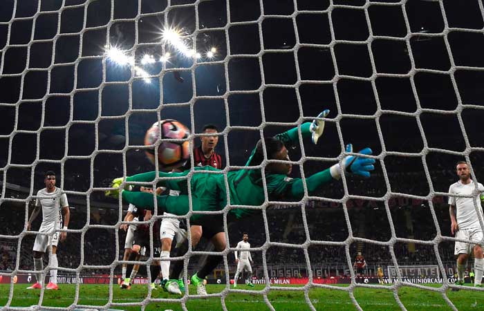 AS Roma's Polish goalkeeper Wojciech Szczesny fails to stop a goal scored by AC Milan's Croatian midfielder Mario Pasalic (not seen) during the Italian Serie A football match at the San Siro stadium in Milan on Monday. — AFP