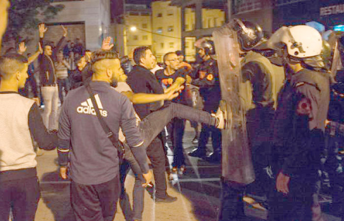 Protesters clash with Moroccan police during a demonstration in the northern city of Al-Hoceima. — AFP