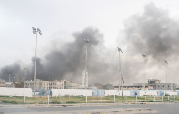 Smoke rises during heavy clashes between rival factions in Tripoli. — Reuters