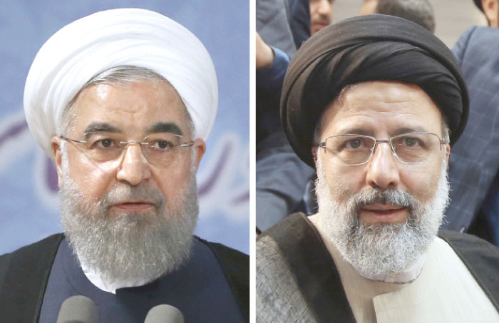 This combination of two file photos shows Iranian President Hassan Rouhani, left, and Iranian presidential candidate Ebrahim Raisi. — AP