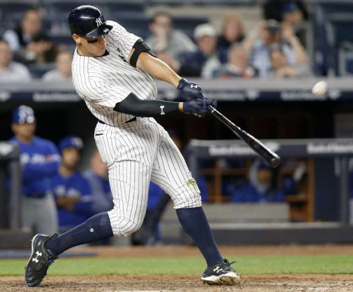 New York Yankees’ Aaron Judge hits a three-run home run off Toronto Blue Jays relief pitcher Jason Grilli during their MLB game in New York Tuesday. — AP