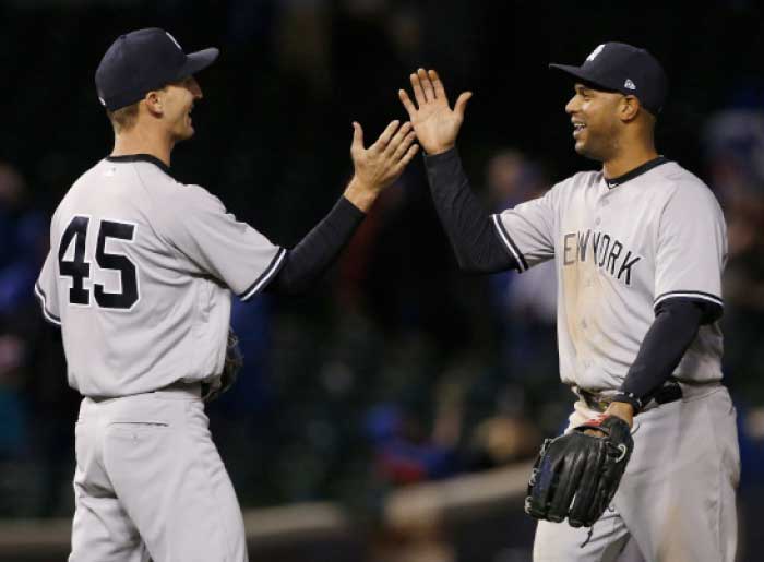 New York Yankees' Aaron Hicks, right, celebrates with relief pitcher Chasen Shreve after the Yankees defeated the Chicago Cubs, 5-4, after the 18th inning of an interleague baseball game Monday in Chicago. — AP