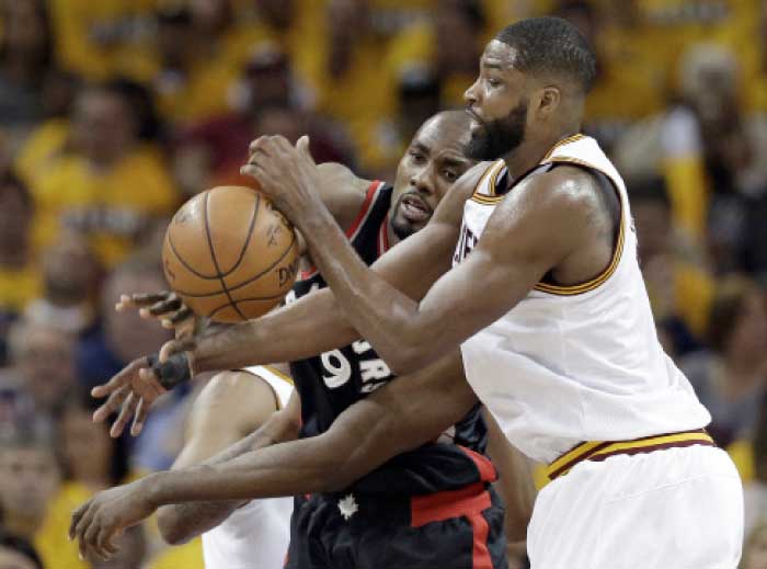 Toronto Raptors' Serge Ibaka, from Congo, and Cleveland Cavaliers' Tristan Thompson, right, battle for the ball in the first half in Game 1 of a second-round NBA basketball playoff series on Monday in Cleveland. The Cavaliers won 116-105. — AP