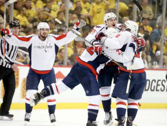 The Washington Capitals celebrate a game-winning goal by defenseman Kevin Shattenkirk (22) in overtime against the Pittsburgh Penguins in game three of the second round of the 2017 Stanley Cup Playoffs at the PPG PAINTS Arena. — AP