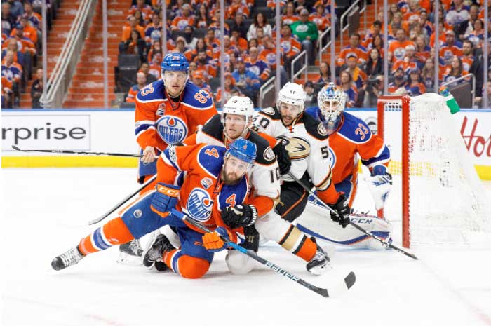 Matthew Benning No. 83 and Kris Russell No. 4 of the Edmonton Oilers battle against Corey Perry No. 10 and Antoine Vermette No. 50 of the Anaheim Ducks in Game Six of the Western Conference Second Round during the NHL Stanley Cup Playoffs at Rogers Place on Sunday in Edmonton, Alberta, Canada. – AFP