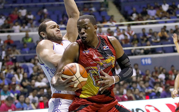 TNT's Kelly Williams sticks to San Miguel Beer's Charles Rhodes like a leech in Friday night's PBA Commissioner's Cup at the Smart-Araneta Coliseum.