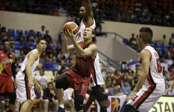 San Miguel Beer's Alex Cabagnot punctures a hole in the Alaska defense in their PBA Commissioner's Cup game in Antipolo City Saturday night.