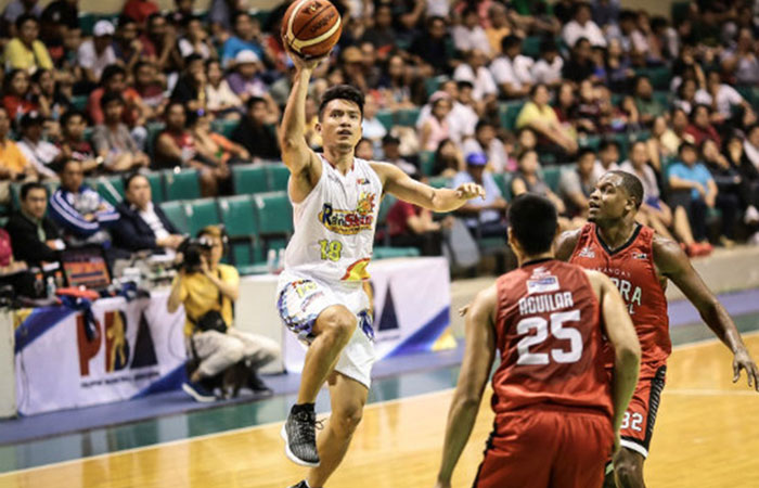 Rain or Shine's James Yap fires his patented one-handed jump shot off Ginebra's Japeth Aguilar and Justin Brownlee in their PBA Commissioner's Cup game at the Cuneta Astrodome Friday night.