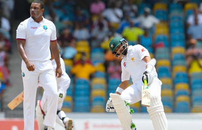 Azhar Ali (R) of Pakistan gets runs off Shannon Gabriel (L) of West Indies during the 2nd day of the 2nd Test match between West Indies and Pakistan at Kensington Oval, Bridgetown. — AFP