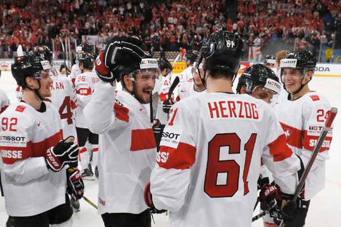 Switzerland's players celebrate after they won the IIHF Men's World Championship group B ice hockey match between Canada and Switzerland in Paris on May 13, 2017. – AFP