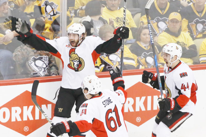 Ottawa Senators’ Bobby Ryan (L) celebrates with teammates after scoring the game-winning goal against the Pittsburgh Penguins during the overtime period of Game 1 of the Eastern Conference finals in Pittsburgh Saturday. — AP