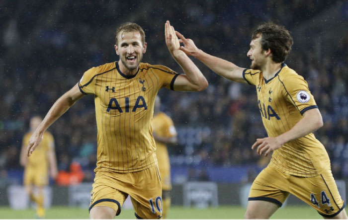 Tottenham’s Harry Kane celebrates after completing his hat trick with Filip Lesniak against Leicester at King Power Stadium Thursday. — Reuters