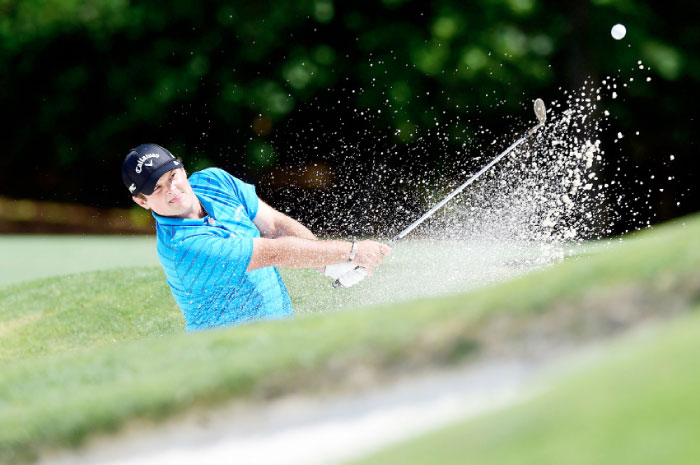 Patrick Reed plays a shot from a bunker on the 11th hole at the Wells Fargo Golf Championship in Wilmington, North Carolina, Saturday. — AFP