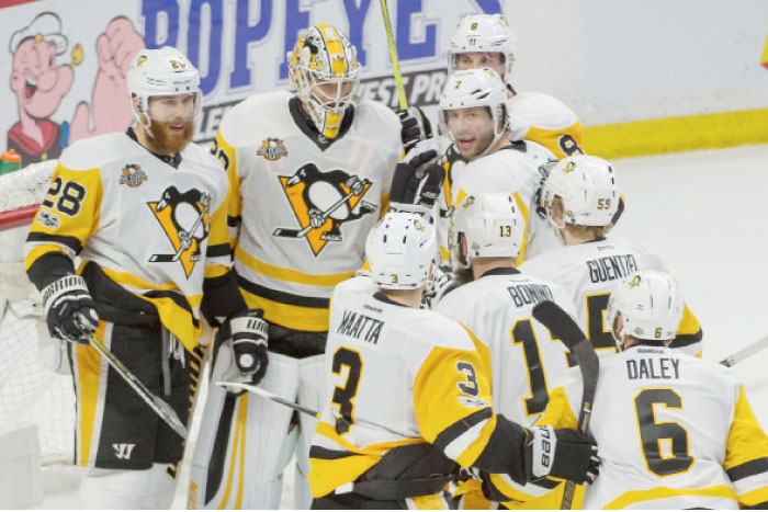 Pittsburgh Penguins’ players celebrate after defeating Ottawa Senators in Game 4 of the NHL Eastern Conference finals at Canadian Tire Centre in Ottawa Friday. — Reuters