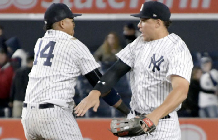 New York Yankees’ right fielder Aaron Judge (R) celebrates with second baseman Starlin Castro after Yankees defeated the Toronto Blue Jays at Yankee Stadium in New York Wednesday. — AP