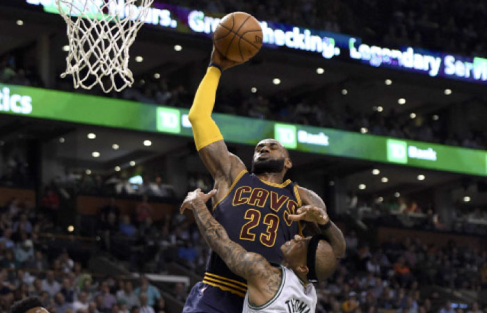 Boston Celtics’ guard Isaiah Thomas fouls Cleveland Cavaliers’ forward LeBron James during Game 1 of the NBA Eastern Conference finals at TD Garden in Boston Wednesday. — Reuters