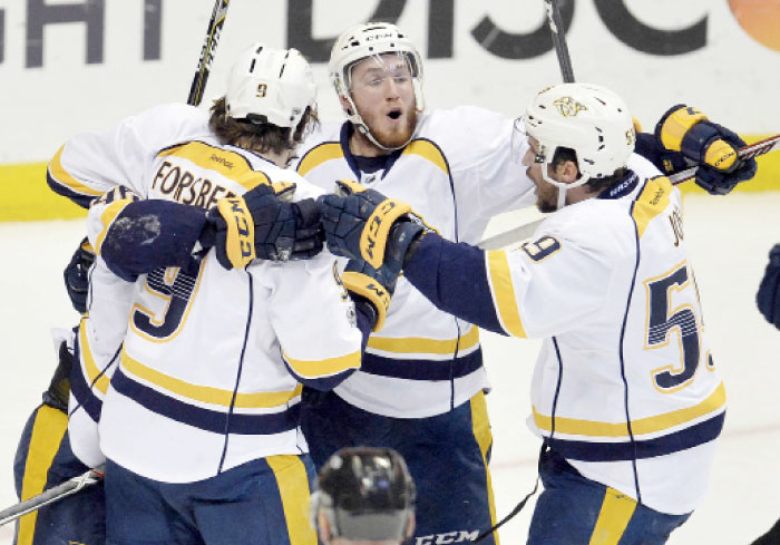 Nashville Predators’ left wing Pontus Aberg (C) celebrates with center Filip Forsberg (L) and defenseman Roman Josi his goal against the Anaheim Ducks during Game 5 of the NHL Western Conference finals at Honda Center in Anaheim Saturday. — Reuters