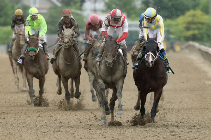 Javier Castellano (2nd R), aboard Cloud Computing, leading the 142nd running of the Preakness Stakes at Pimlico Race Course in Baltimore Saturday. — Reuters