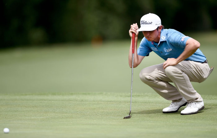 J.T. Poston lines up a putt on the fifth green at the Dean & Deluca Invitational at Colonial Country Club in Fort Worth, Texas, Thursday. — AFP