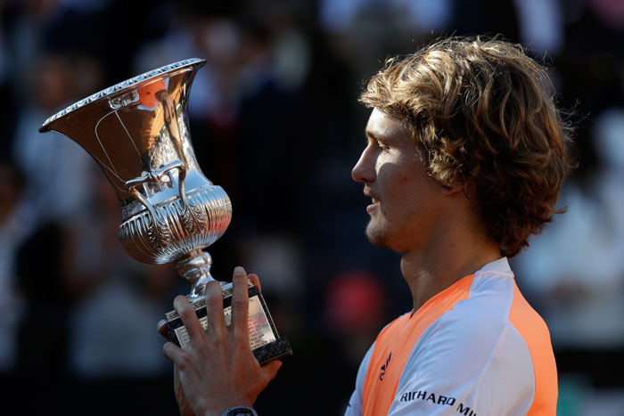 Germany's Alexander Zverev holds the trophy after winning the final against Serbia's Novak Djokovic at the Italian Open in Rome Sunday. — AP