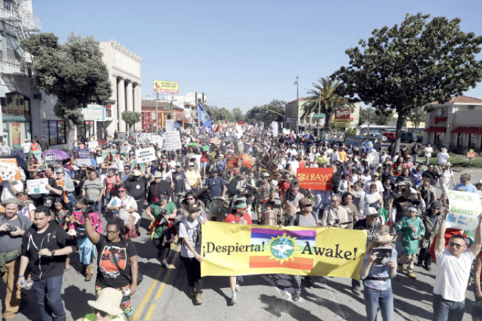 A group marches during a May Day demonstration in Oakland, California, on Monday. — AP