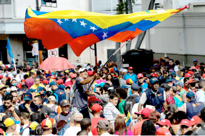 Supporters of Venezuelan President Nicolas Maduro rally to support the  proposal to reform the constitution in Caracas on Tuesday. — AFP