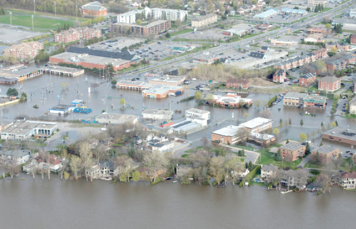 An overhead view showing the flooded residential Montreal suburb of Pierrefonds, Quebec, Canada, on Monday. — Reuters