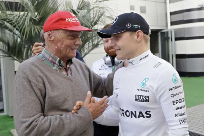 Mercedes driver Valtteri Bottas of Finland, right, shakes hands with three-time world champion Niki Lauda after winning the Formula One Russian Grand Prix at the 'Sochi Autodrom' circuit, in Sochi, Russia, Sunday. — AP