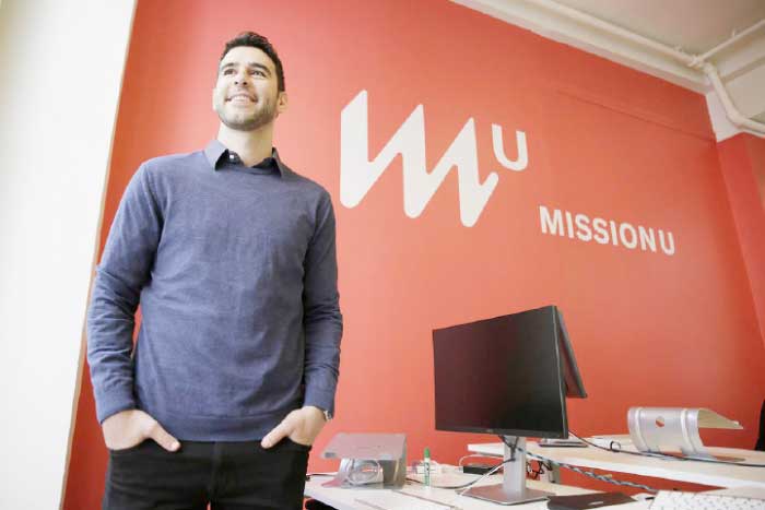 Founder Adam Braun is seen posing at MissionU in San Francisco. MissionU, which began accepting its first applications last month, offers a one-year program in data analytics and business intelligence with an upfront tuition of $0. As part of a profit-sharing agreement, MissionU students will be giving back 15 percent of their salary for three years after graduation, given that they make at least $50,000 per year. — AP