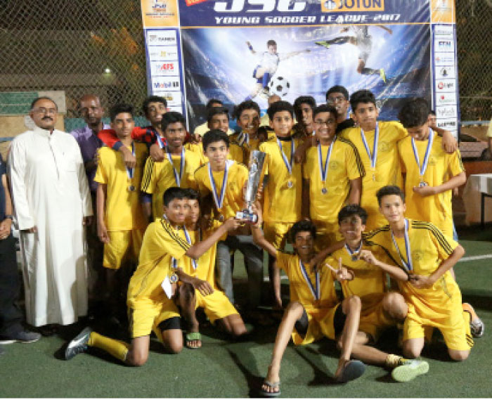 IISJ Juniors with YSL trophy handed over by Eritrean Fottball Association President.