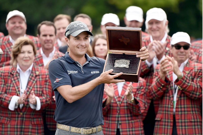 Kevin Kisner accepts a custom made belt buckle after winning the Dean & Deluca Invitational on Sunday in Fort Worth, Texas. — AFP