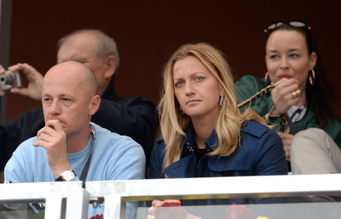 Petr Pala, headcoach of Czech Fed Cup team and Czech tennis player Petra Kvitova watch the final match between German Mona Barthel and Czech's Kristyna Pliskova during at the Prague Open recently in Prague. — AFP