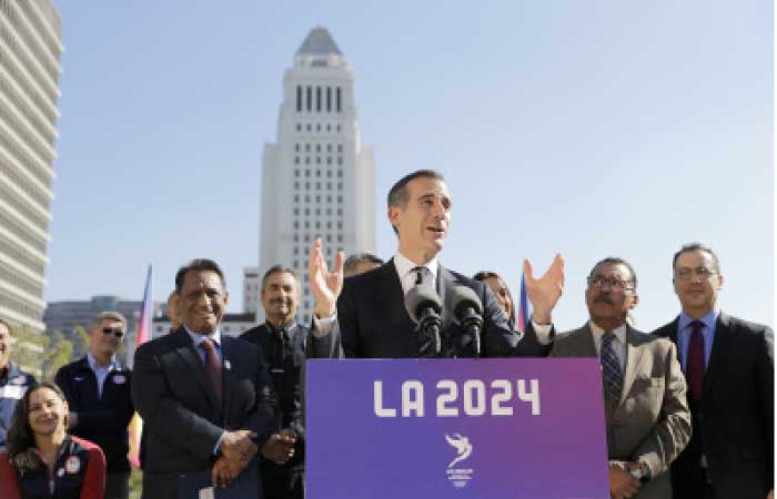 In this file photo, Los Angeles Mayor Eric Garcetti, center, speaks during a news conference in Los Angeles. Los Angeles leaders this week are trying to sell their plan to host the Olympic Games to visiting members of the International Olympic Committee. — AP