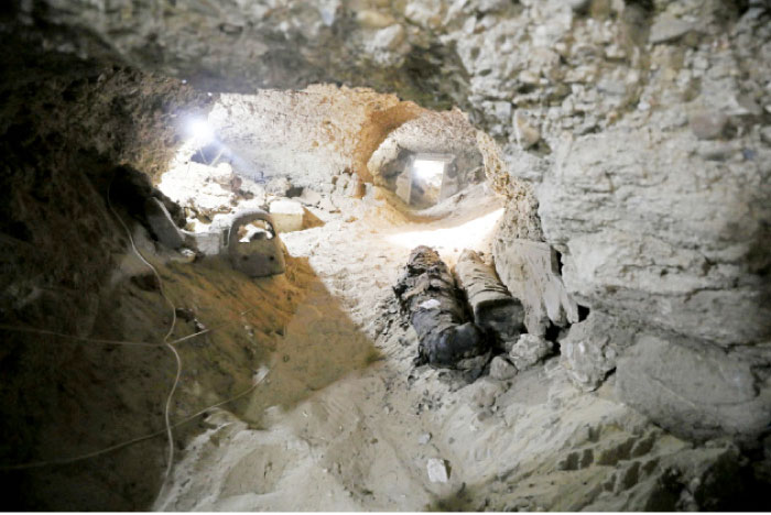 A number of mummies inside the newly discovered burial site in Minya, Egypt. — Reuters