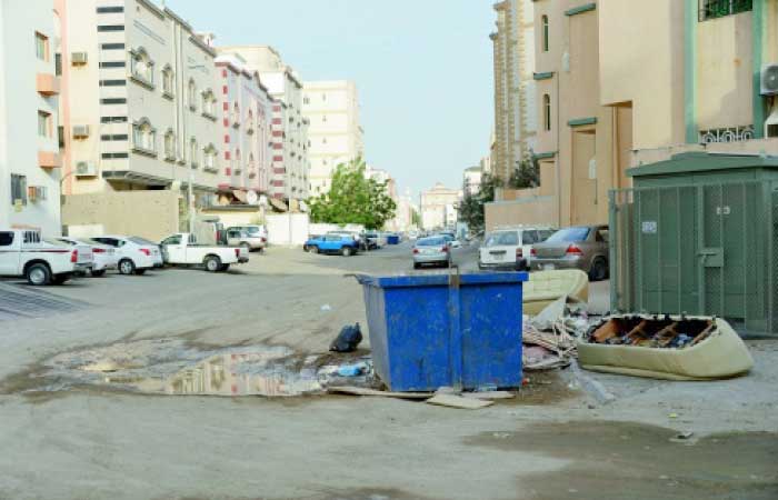 Surfacing of sewage water has destroyed roads and streets in Waziriya district in south Jeddah while stagnant swamps produce mosquitoes and spread nasty odor. — Okaz photo